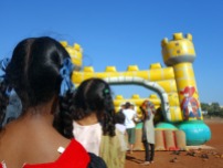 Children waiting in line to jump in Mapusa, Goa