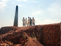 Curious workers in the brick kiln near Lahore, Pakistan